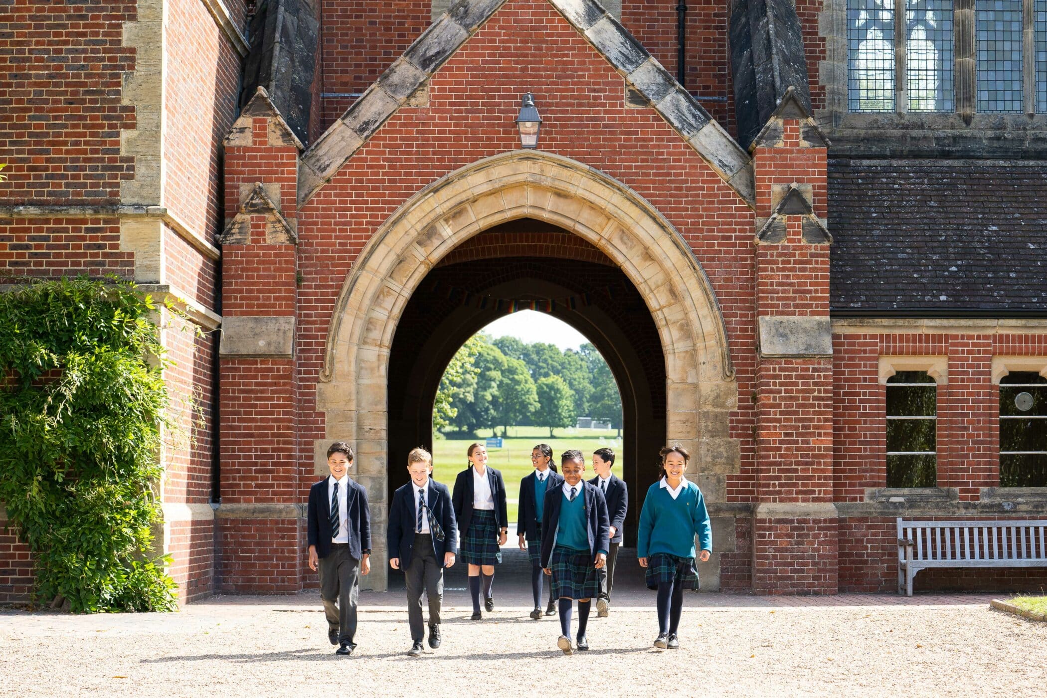 Pupils walking through archway