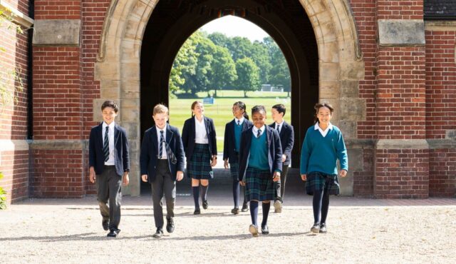 Pupils walking through archway